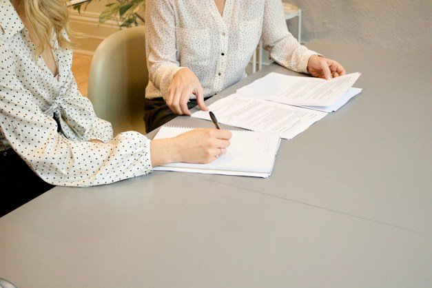 Signing incorporation documents at a meeting table